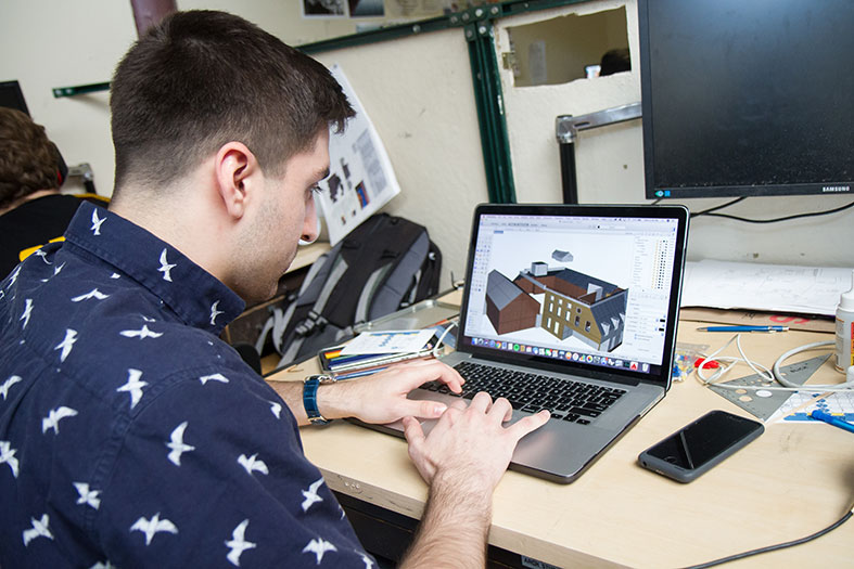 Architecture student working at his station