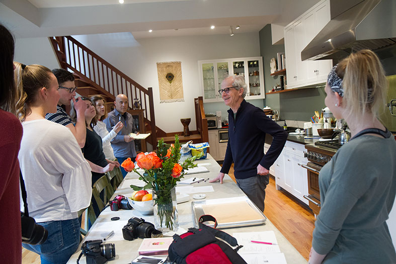 Students listen as Schumacher goes over his baking process.