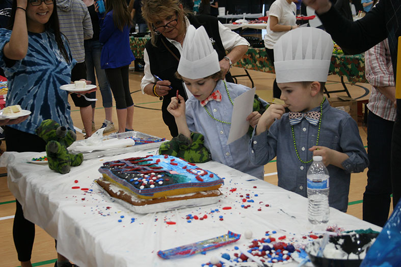 Judges taste the cakes.