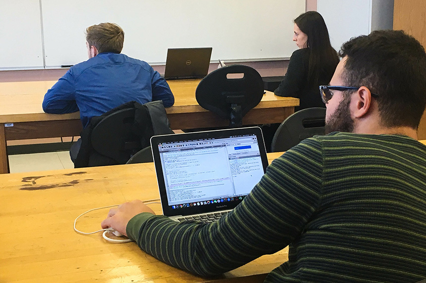 A student in a Computer Science classroom