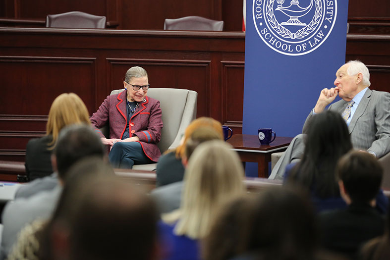 Ruth Bader Ginsburg talks with Judge Bruce Selya.