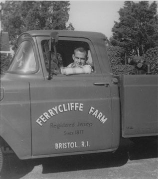 Enzly "Jimmy" Ramsay driving a Ferrycliffe Farm truck.