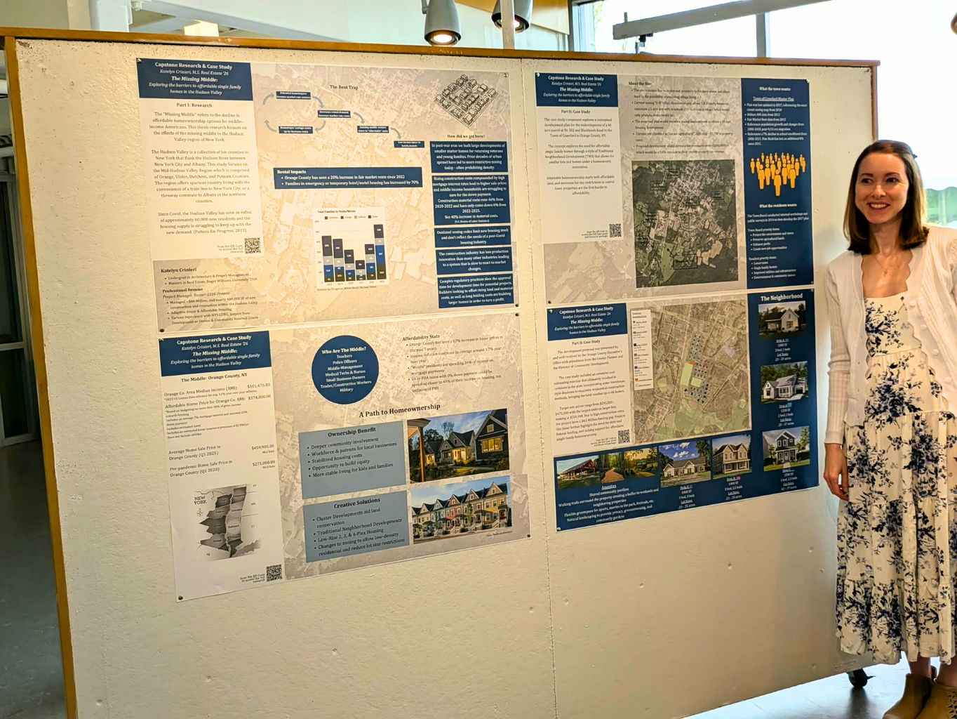 Crinieri stands with her “missing middle” housing development proposal in the Cummings School of Architecture's Grad Gallery.