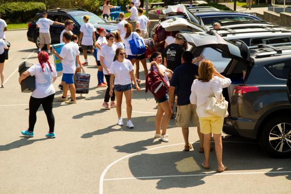 Move in crew helping parents move in