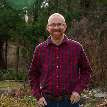 A photo of Professor Loren Byrne standing outside 