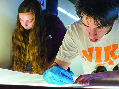 Two students working on a forensics project 