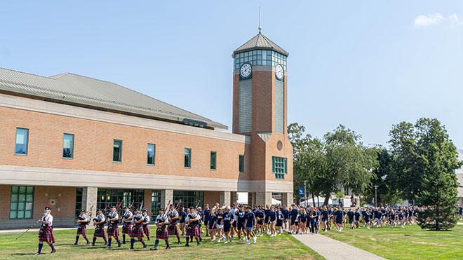 New students processing across the quad to Convocation. 