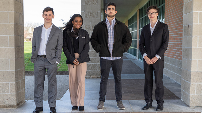 A group of students standing outside the library 