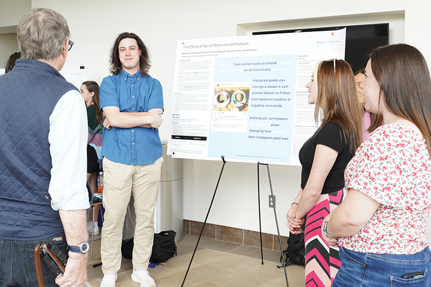 Psychology students presenting a poster at SASH 