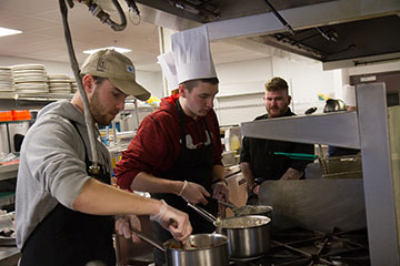 Students cooking in the Iron Chef meal-budget challenge.