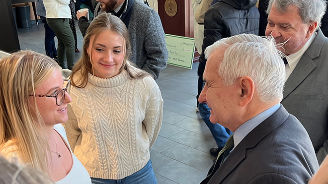 Senator Jack Reed and President Ioannis Miaoulis speak with students