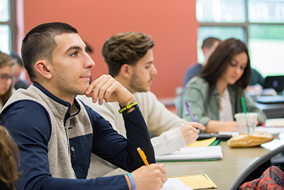 image of RWU student concentrating in class