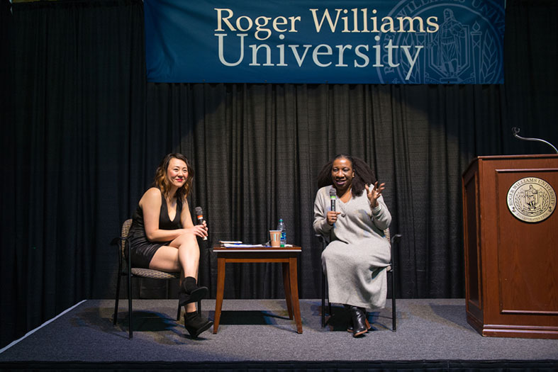 Tarana Burke converses with a moderator during her lecture.