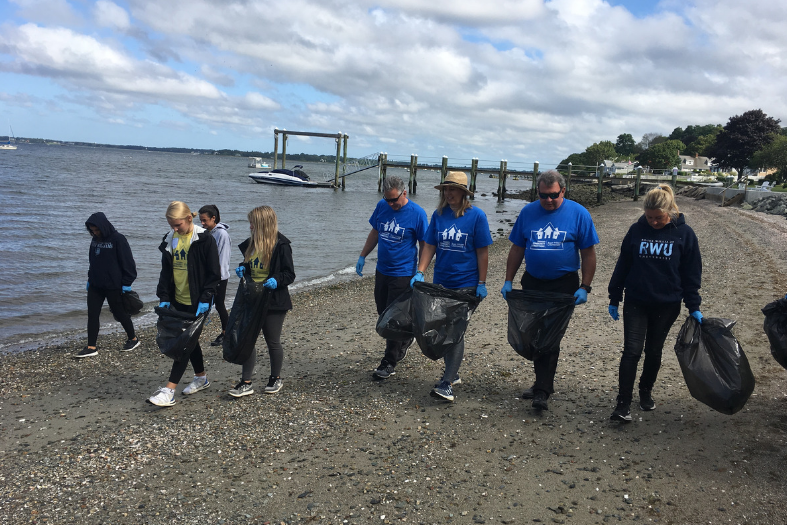 Volunteers picking up trash on the beach