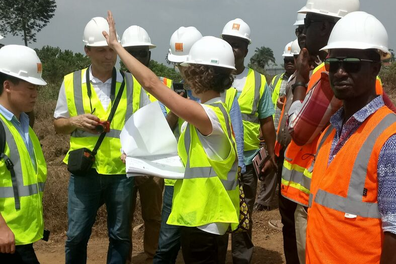 People gathering on construction site in gear. 