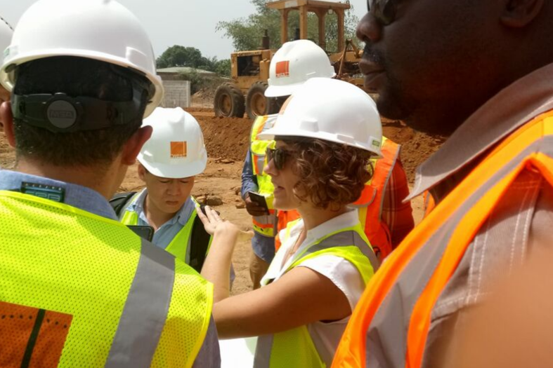 People gathering on construction site in gear. 