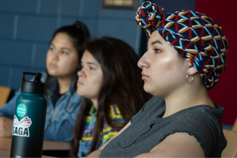 Students listening at workshop. 