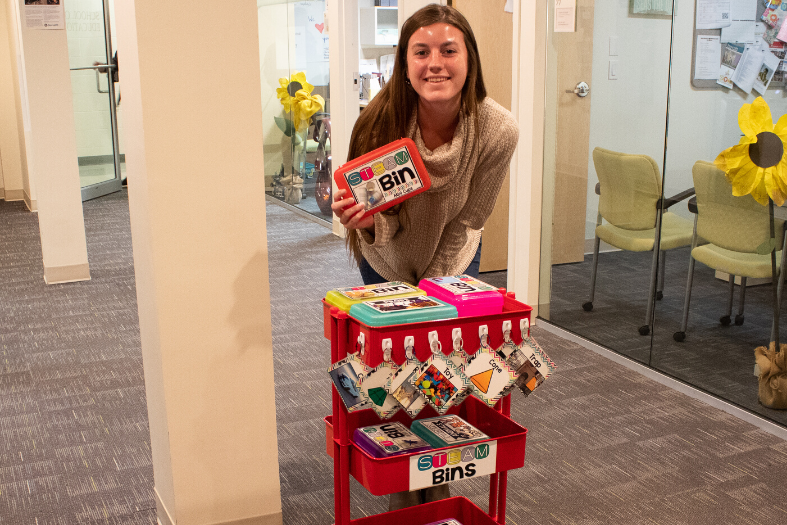 RWU student with STEAM bins