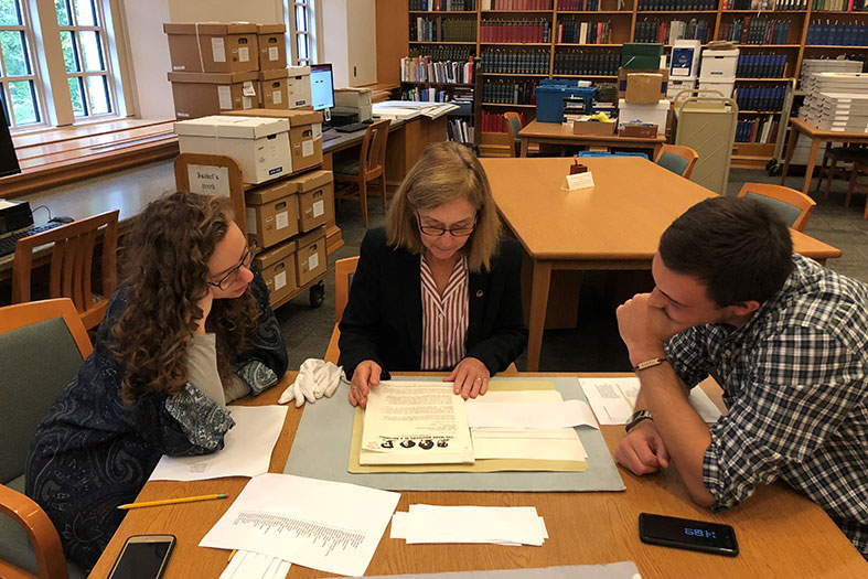 Students and staff examine artifacts in the Vonnegut archive.