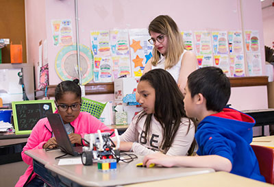 A RWU student teacher observing students