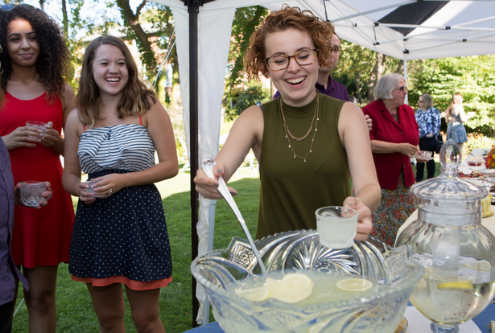 Student serving lemonade.