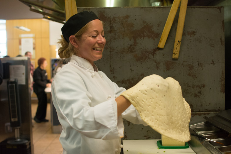 Woman making pizza