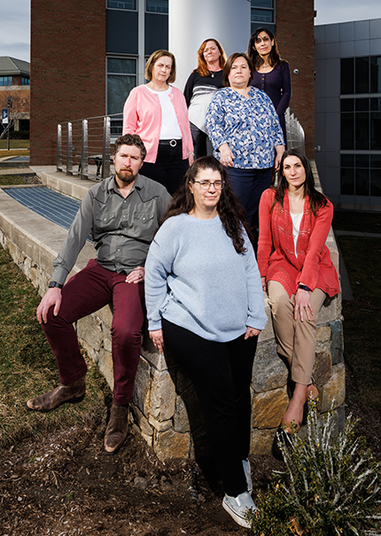 A group of RWU faculty and staff look at the camera with serious expressions