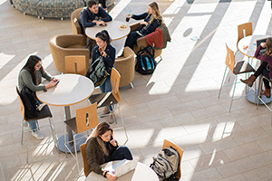 students sitting at tables in the Global Heritage Hall