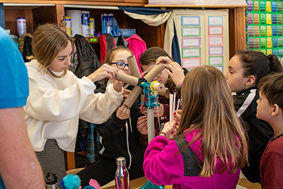 image of RWU students teaching fourth-graders about wind energy