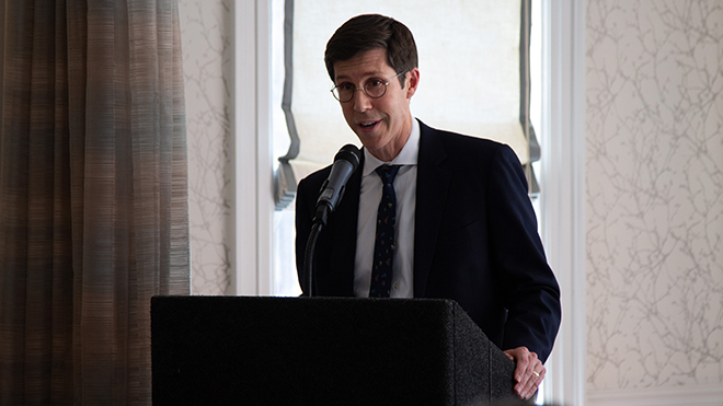 Providence Mayor Brett Smiley addresses the crowd at a podium