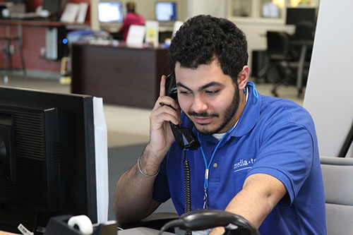 MediaTech staff member on phone