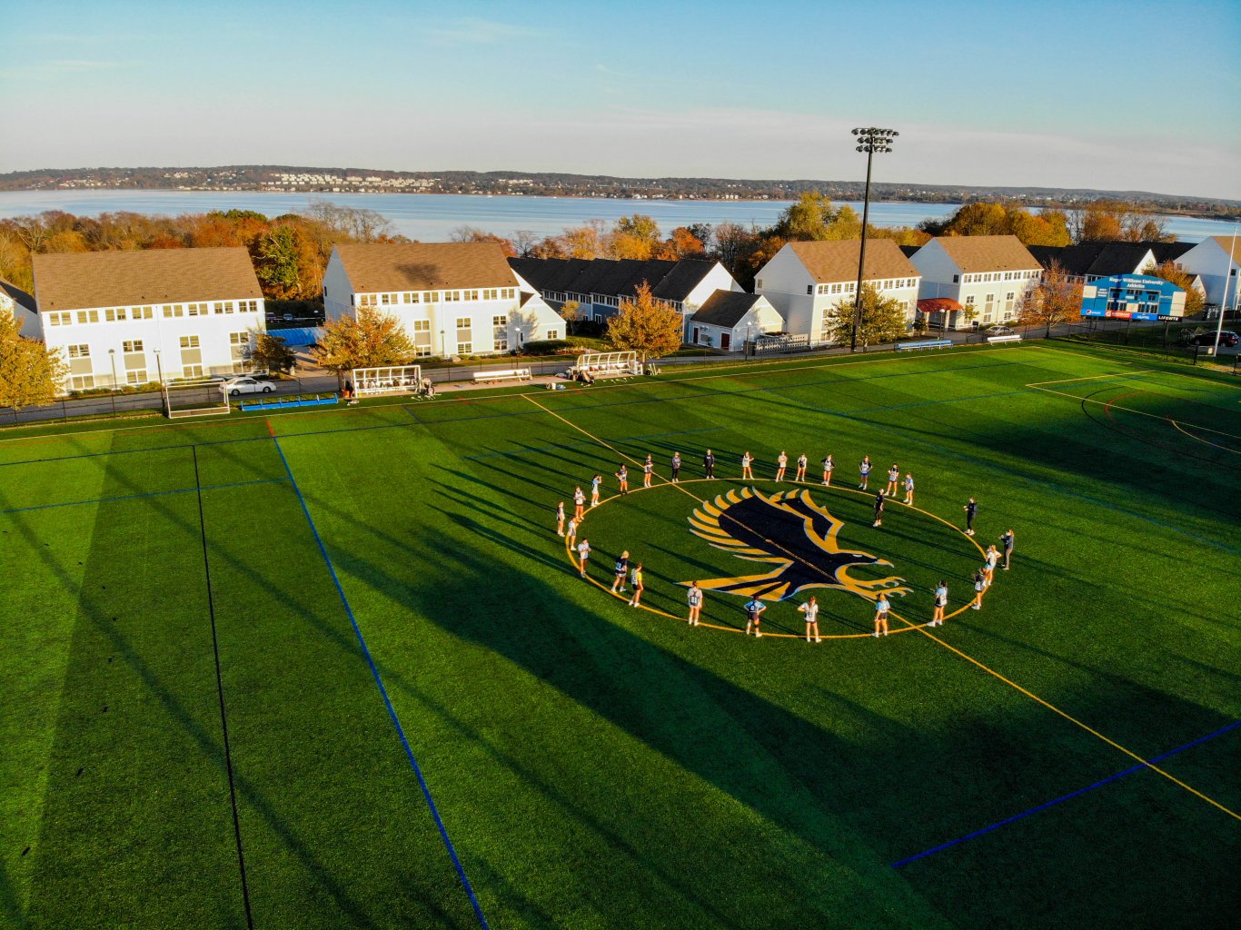 Women's lacrosse team groups up before practice