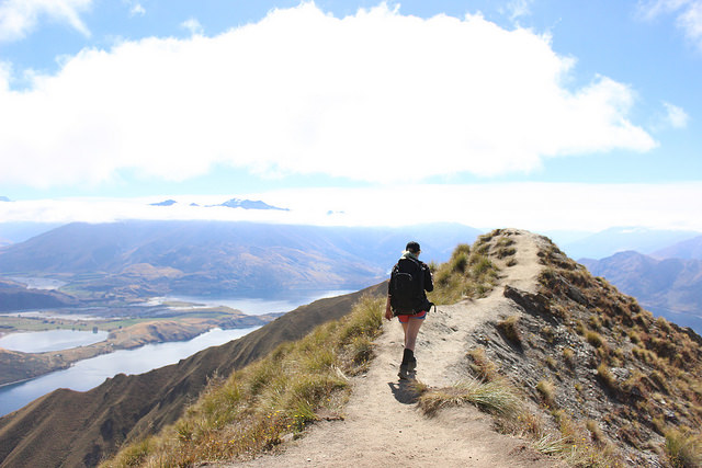 Person hiking mountaintop