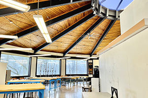 Interior view of the Fine Arts Center showing work tables, windows, and skylight