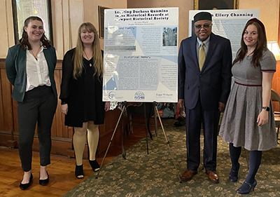 Students and faculty pose with their research