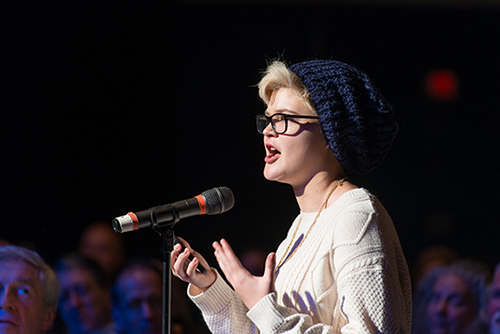 Student speaks into a microphone