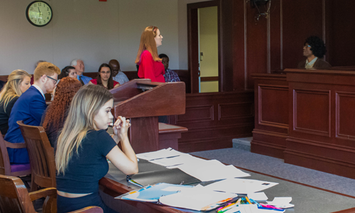 student questions witness during mock trial