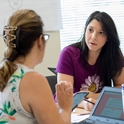 Two teachers talk about their teaching strategy.