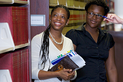 Students smile in library