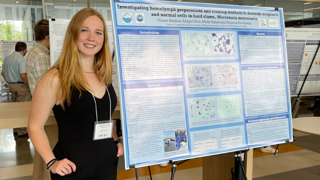 Student with research poster