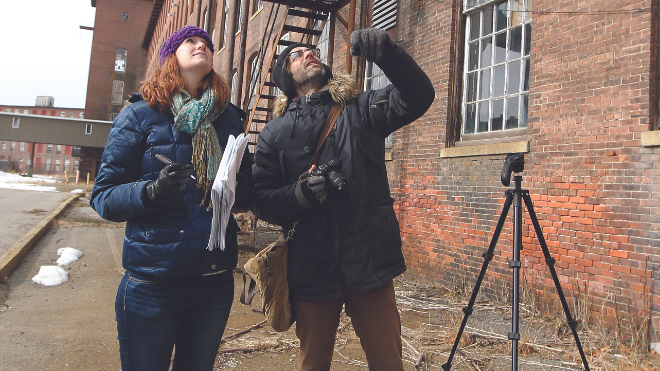 Students examine building