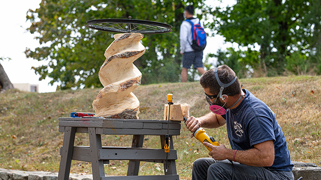 Student sculpting outdors