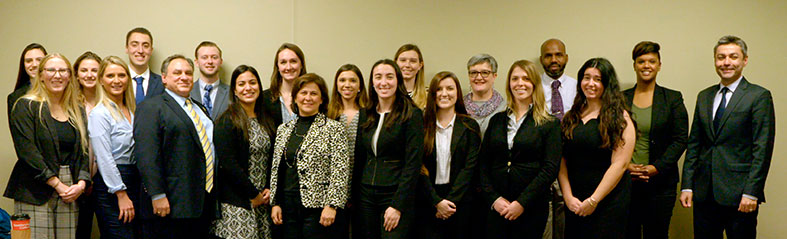 Students and state officials pos for group photo.