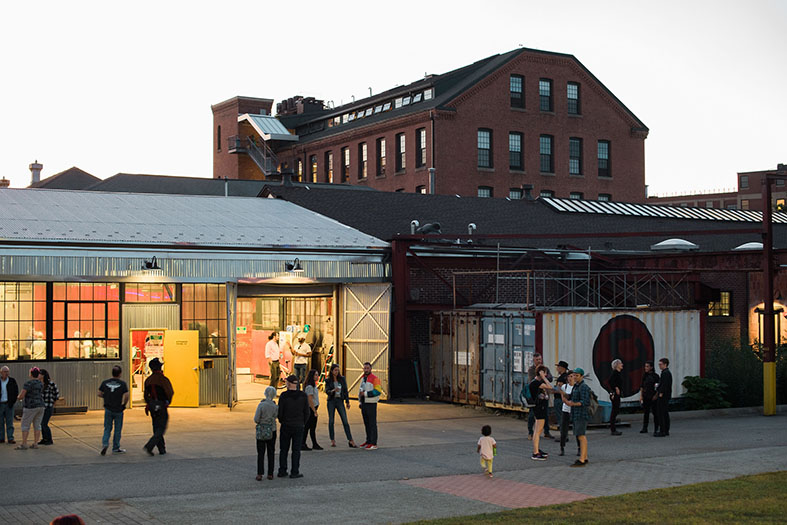 Community Members gather outside the Steel Yard Super Studio