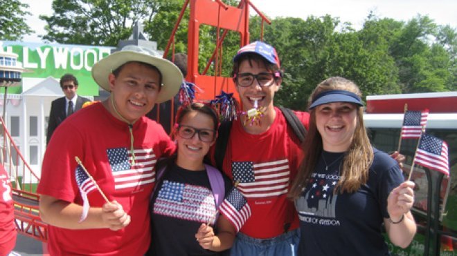 A group of students pose on the float they built.