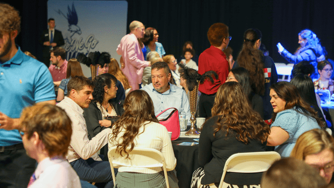 Students, faculty, staff, and families gathered in the Campus Recreation Center Field House on May 3.