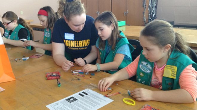 Students mentor Girl Scouts.