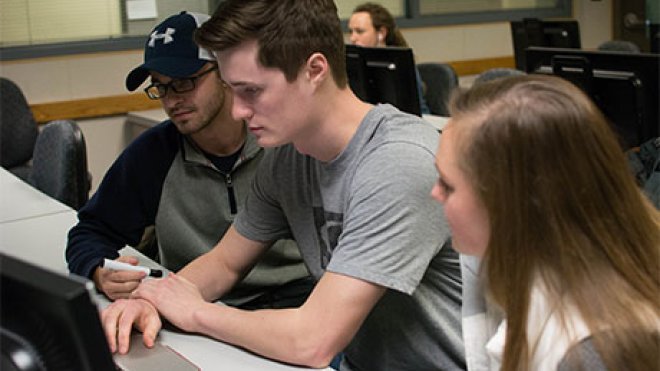 Students working at a computer.