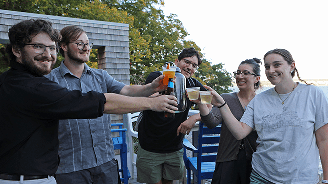 Architecture students gather on the deck of the RWU Sailing Center