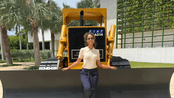 Francisco posing with a bulldozer in the Dominican Republic. 